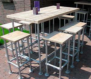 Outside bar and matching stools made from scaffold tubes with planks.