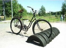 Repurposed car tires as stand for bicles.