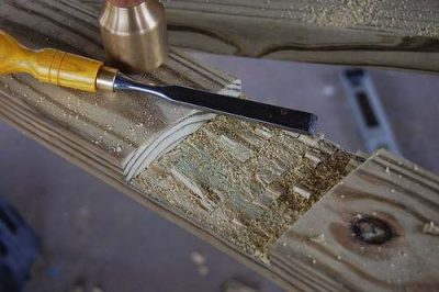 Use a sharp chisel to remove the surplus wood chips.