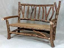 Farmhouse style bench made out of branches.