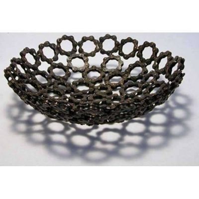 Repurposed reclaimed bicycle chains as fruitbowl.