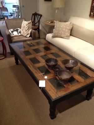 Repurposed door as tabletop for a coffee table in lounge style.