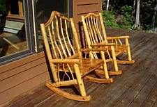 Rocking chairs made from spruce and branches.