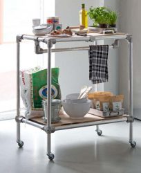 Trolley with shelves, made from scaffold tubes.